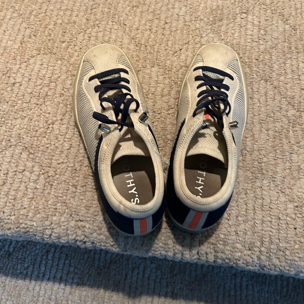 Used condition- Rothy Sneakers - navy blue and cream. Small fray at ankle.